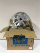 A boxed Elmo 16-F 16mm sound projector