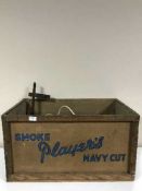 A mid 20th century Players Navy Cut crate, two industrial heat lamps, vintage tin,