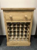 A reclaimed pine bottle rack,