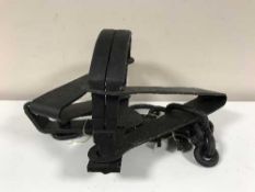 A reproduction cast iron bear trap