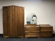 A three piece oak Beanese bedroom suite