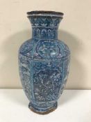 A Persian tin glazed terracotta vase