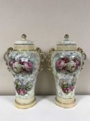 A pair of early 20th century transfer printed lidded vases