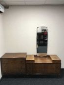A mid 20th century walnut three drawer chest and dressing chest