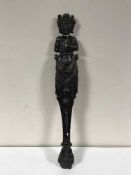 An early 19th century oak carving - female figure with hand on chest