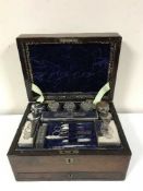 A Victorian rosewood dressing table box and contents