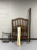 An antique mahogany 3' rail bed frame together with a brass pole with fittings and Singer treadle
