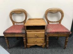 A pair of Victorian mahogany balloon backed chairs together with a pine bedside stand