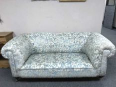 An early twentieth century chesterfield settee,