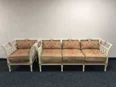 A contemporary wood framed three seater settee and armchair