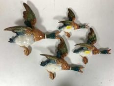 Four graduated Beswick flying ducks,