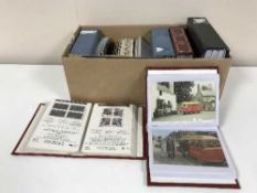 A box of assorted 20th century postcards and stamps