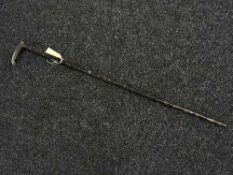 A bone handled whistling walking stick