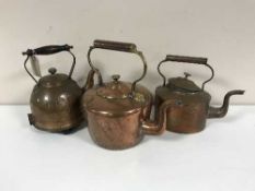 Three antique copper kettles
