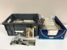 Two boxes of 20th century colour and monochrome postcards,