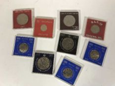 A box of a collection of assorted cased British Gibraltar and Guernsey crowns,