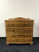 A shaped pine four drawer chest