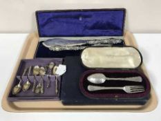 A cased silver fork and spoon, box of silver apostle spoons,