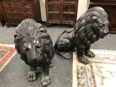 An impressive pair of bronze lion statues,
