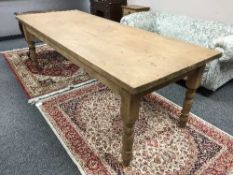 A reclaimed pine farmhouse dining table,