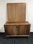 A mid 20th century rosewood cabinet and a folding teak card table