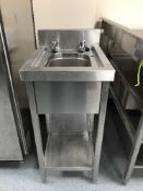 A stainless steel single sink unit with shelf