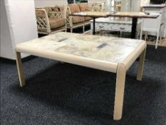 A Danish beech coffee table with travertine tiled top