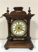A late 19th century German mantel clock with enamelled dial