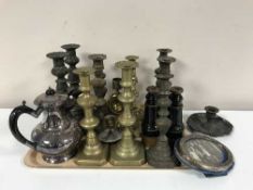 A box of brass candlesticks,