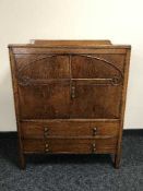 A 1930's oak linen cupboard fitted two drawers