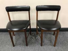 A set of four mid-20th century teak dining chairs