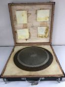 Three graduated cymbals in a case