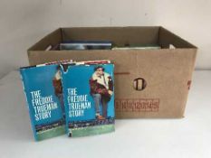 Two boxes of hard back books relating to cricket