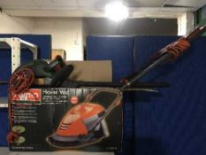 A boxed Flymo hover mower together with a Black and Decker electric hedge trimmer
