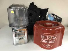 A Beaver counter top sweet dispenser together with a Southern Comfort ice bucket and a box of