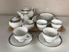 A tray containing eighteen pieces of Wedgwood Amherst bone china