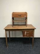 A mid-20th century teak desk fitted two drawers,