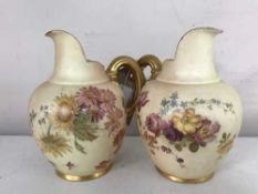 Two Royal Worcester blush ivory and gilded jugs,