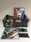 A crate of LP records and 45's all relating to The Beatles inc.