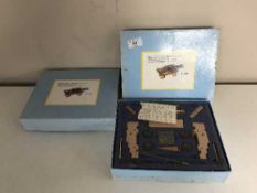 Two boxed Italian naval cannon model kits
