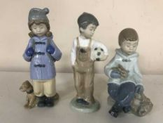 Three Nao figures - Both seated with rabbit,