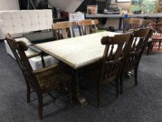A colonial style refectory table together with a set of six heavy dining chairs,