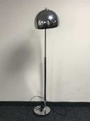 A chrome floor lamp