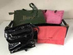Four boxes of assorted lady's hand bags and a simulated fur coat