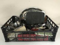 A crate of a large quantity of stainless steel flatware,