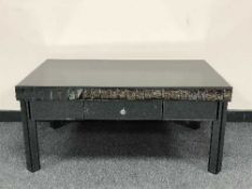 An all glass mirrored coffee table