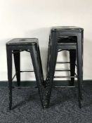 A set of three contemporary metal bar stools