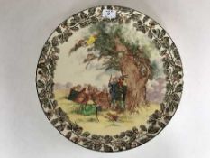 A Royal Doulton Under The Greenwood charger depicting Robin Hood and His Merry Men, 38.