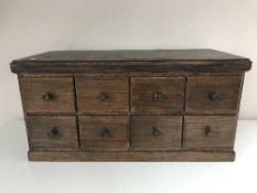 An oak eight drawer index chest