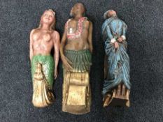 Three plastic ship's figure heads